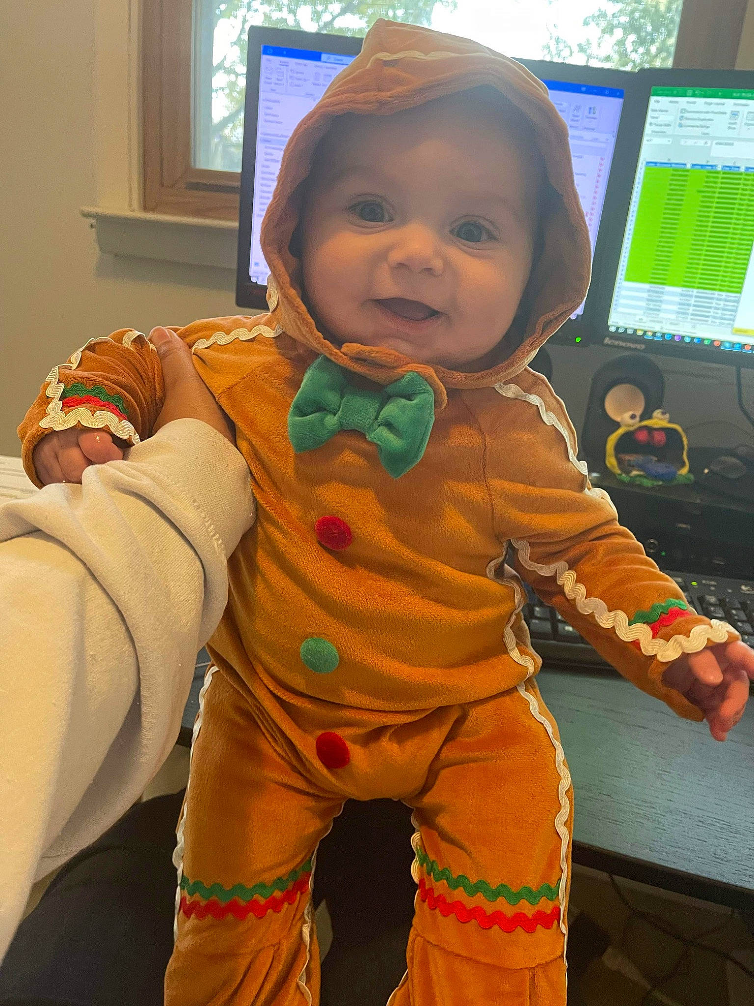 Kingsley is registered to the contest to win money with this photo: baby_toddler_clothing, cheek, child, cool, eye, face, finger, gesture, hand, happy, head, nose, orange, outerwear, person, skin, sleeve, smile, standing, thumb