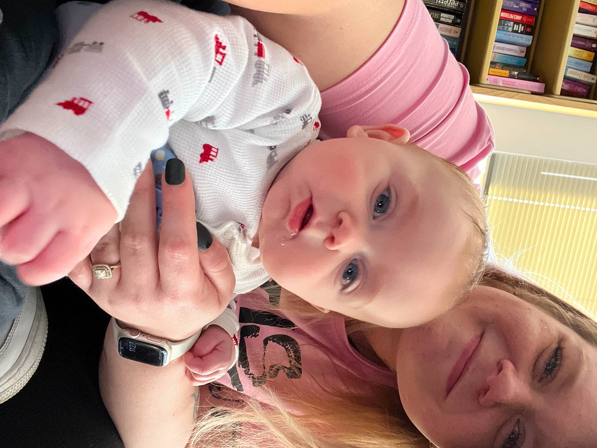 Kingsley joined the competition — help win amazing prizes! arm, baby, bookcase, cheek, eye, eyelash, finger, gesture, happy, head, human_body, iris, joy, lip, mouth, muscle, neck, nose, person, shelf