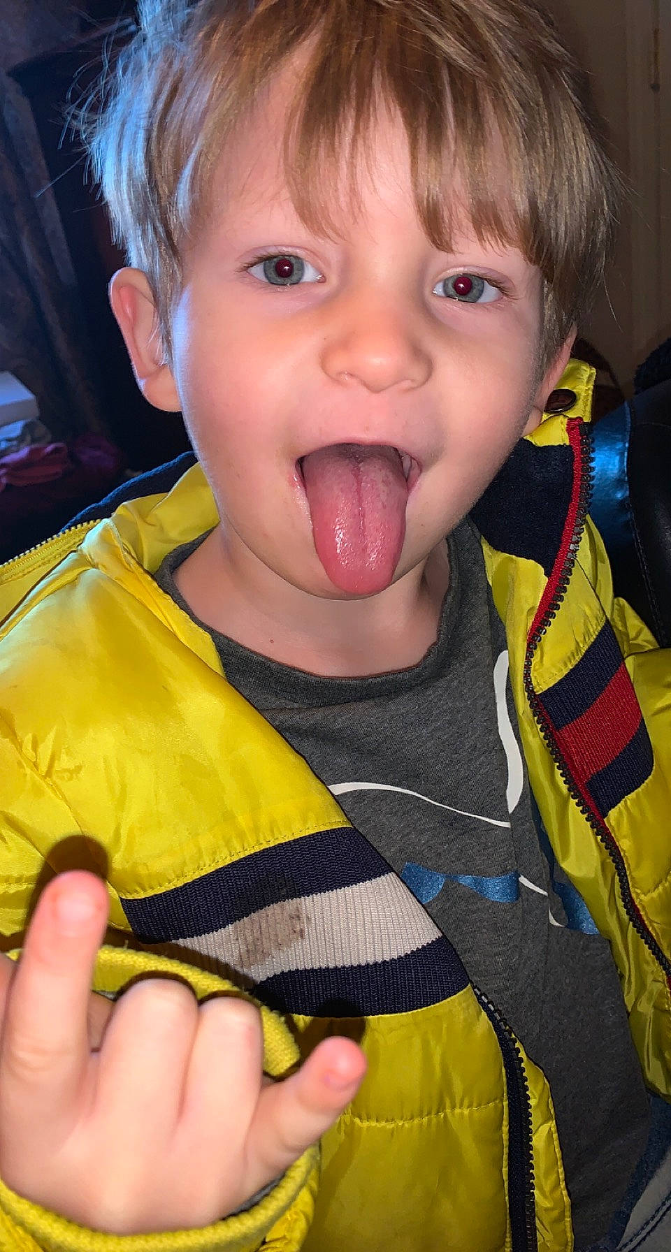 Dylan is registered to the contest to win money with this photo: cheek, ear, eye, eyelash, face, facial_expression, finger, gesture, hand, happy, iris, jaw, lip, mouth, nose, person, skin, thumb, toddler, tongue