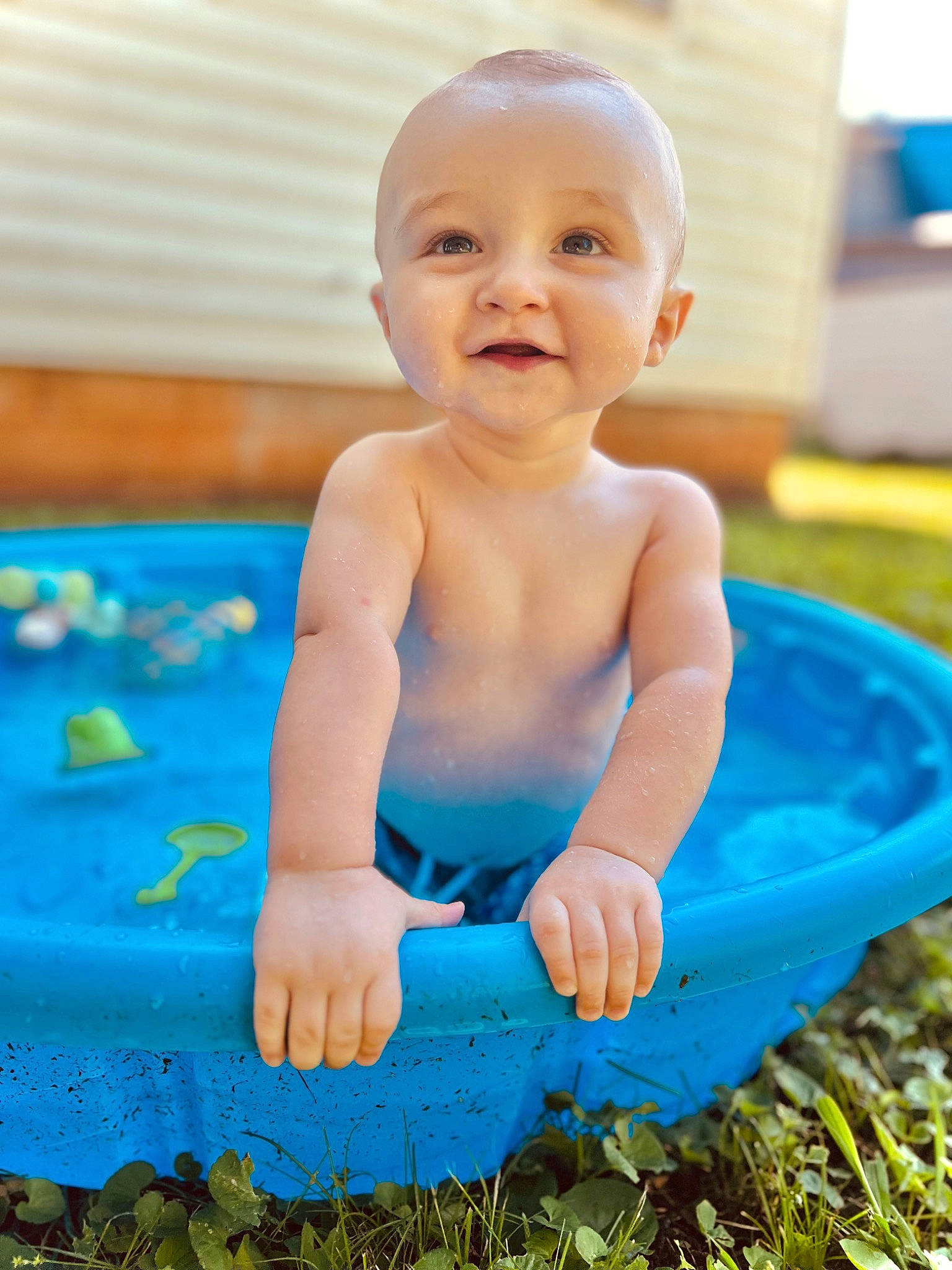 Brayden is registered to the contest to win money with this photo: aqua, baby, baby_bathing, baby_playing_with_toys, baby_toddler_clothing, bathing, blue, child, electric_blue, facial_expression, fun, grass, happy, joy, leisure, people_in_nature, person, play, product, recreation