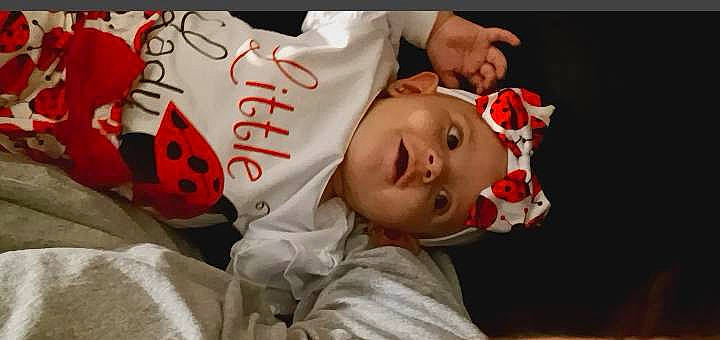 Miracle is registered to the contest to win money with this photo: baby, baby_toddler_clothing, carmine, cheek, child, event, eyelash, flash_photography, flesh, happy, headwear, lip, mammal, mouth, pattern, person, sleeve, textile, toddler, tradition