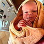 Kaïron participe au concours pour gagner de l'argent avec cette photo : baby, blanket, child, closeup, cozy, cute, expression, face, hands, holding, indoor, infant, newborn, person, portrait, skin, soft, towel, warm, wrapped