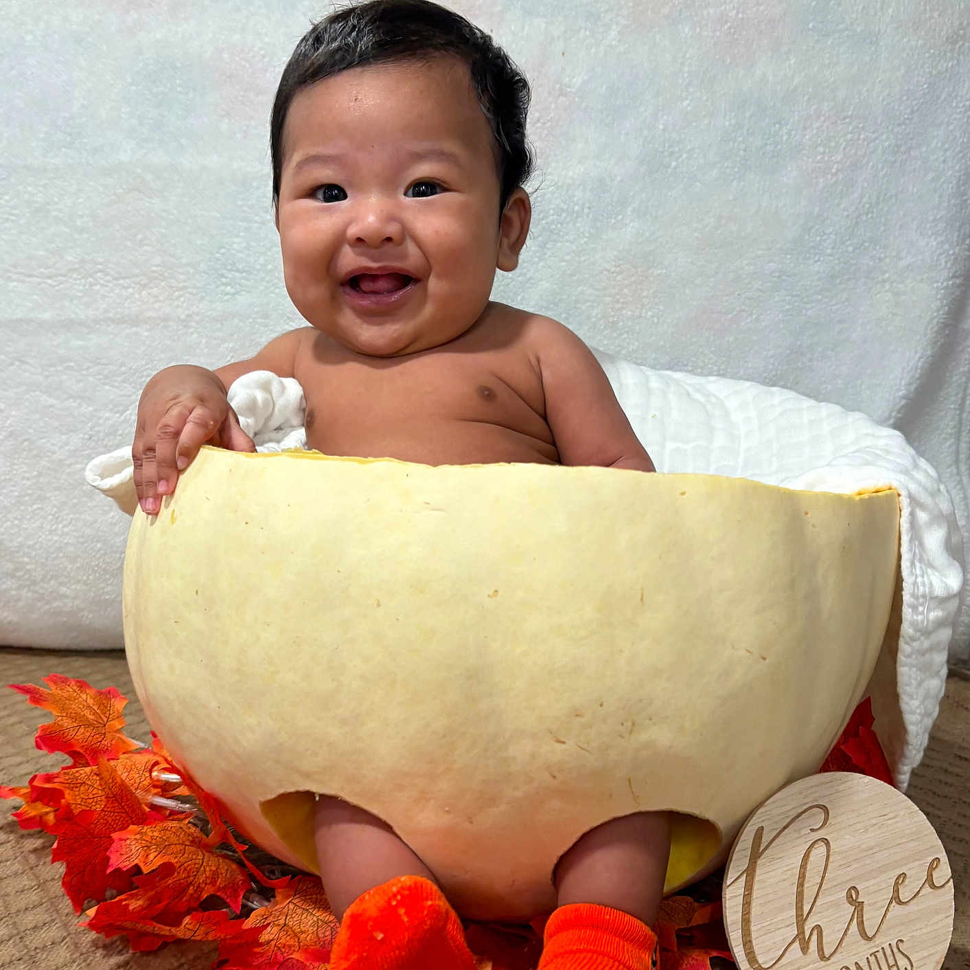 Keano John is registered to the contest to win money with this photo: autumn_leaves, baby, carpet, celebration, child, cozy, cute, fall, happy, holiday, indoor, infant, milestone, orange_socks, portrait, pumpkin, seasonal, smiling, three_months, wooden_sign