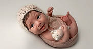 Angelina is registered to the contest to win money with this photo: adorable, baby, blanket, child, closeup, cute, infant, innocent, knitted_bonnet, lying_down, neutral_background, newborn, plush_toy, portrait, small_feet, small_hands, smiling, soft_texture, studio_lighting, wrapped