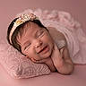 Angelina is registered to the contest to win money with this photo: newborn, baby, infant, smiling, sleeping, headband, pink, pillow, fabric, portrait, cute, resting, peaceful, soft, skin, child, young, face, hands, studio