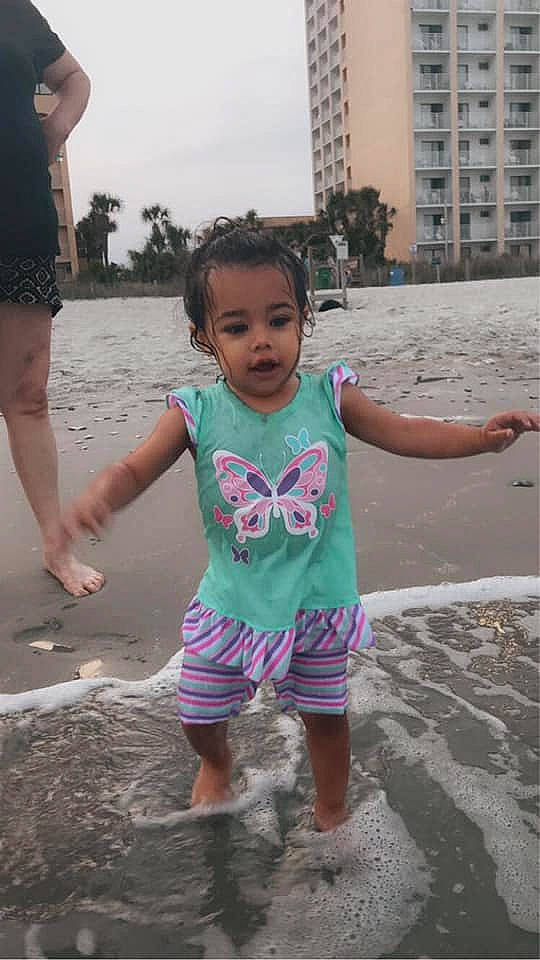 Ka'Leigha joined the competition — help win amazing prizes! baby_toddler_clothing, beach, building, child, fun, hairstyle, happy, leg, leisure, morning, people_on_beach, person, pink, public_space, shorts, skin, sky, standing, toddler, travel