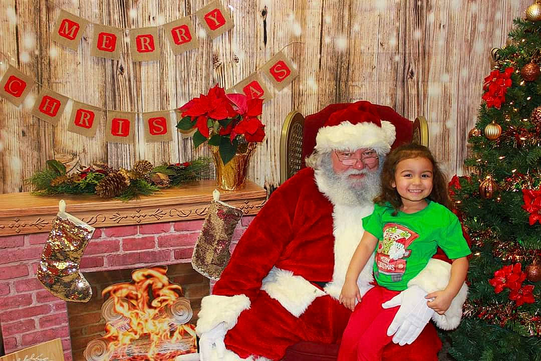 Sherlyn joined the competition — help win amazing prizes! christmas, christmas_decoration, christmas_eve, christmas_ornament, christmas_stocking, christmas_tree, event, fictional_character, headwear, holiday, interior_design, joy, lap, person, santa_claus, tradition