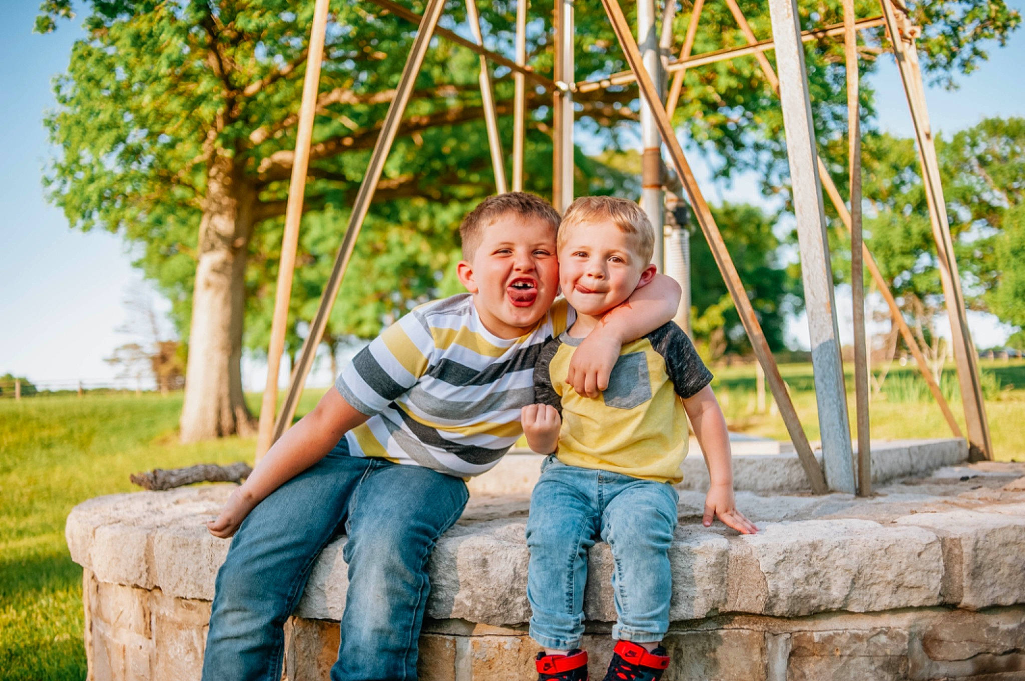Kainen is registered to the contest to win money with this photo: child, facial_expression, flash_photography, fun, gesture, grass, happy, joy, leaf, leisure, people, people_in_nature, person, plant, recreation, shorts, sky, smile, summer, toddler