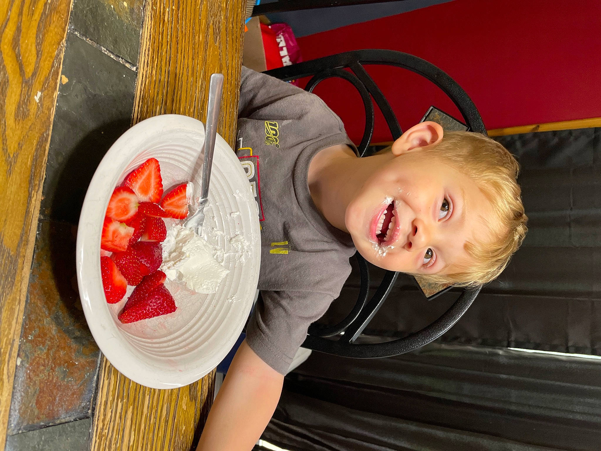 Kainen joined the competition — help win amazing prizes! baby, baby_toddler_clothing, child, cooking, cuisine, dish, food, fun, happy, ingredient, person, plate, recipe, sitting, smile, t_shirt, table, tableware, toddler, vegetable