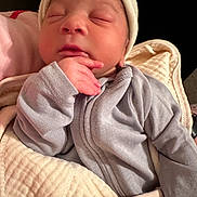 Kyuss is registered to the contest to win money with this photo: newborn, baby, infant, sleeping, blanket, clothing, onesie, cap, hand, face, peaceful, cute, portrait, soft, cozy, indoors, child, human, skin, resting