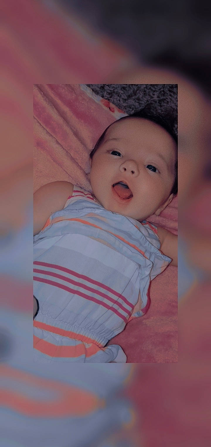 Rosie-maria joined the competition — help win amazing prizes! baby, baby_products, baby_toddler_clothing, cheek, child, comfort, happy, iris, linens, lip, magenta, nose, pattern, person, pink, portrait_photography, room, skin, sleeve, smile