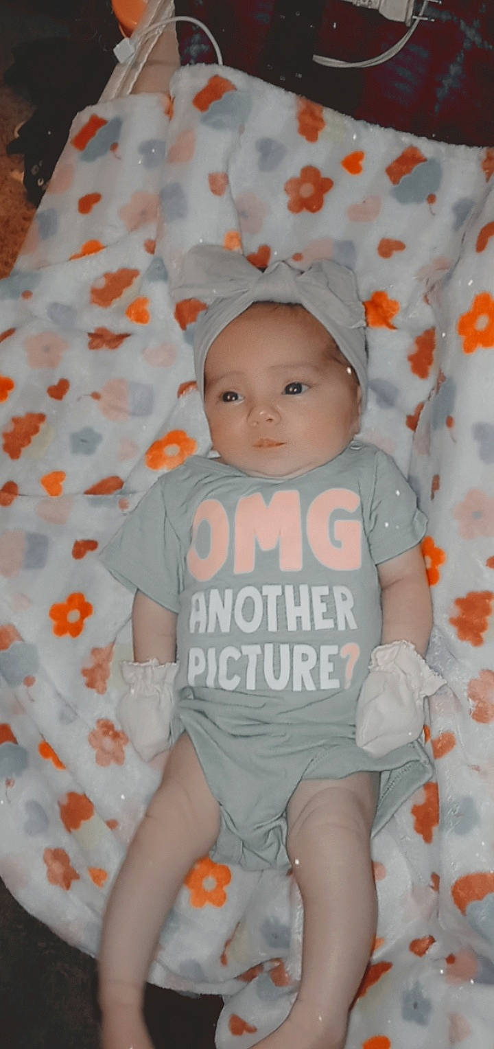 Rosie-maria joined the competition — help win amazing prizes! baby, baby_products, baby_toddler_clothing, cheek, child, face, happy, head, linens, orange, pattern, person, pink, product, skin, sleeve, smile, t_shirt, textile, toddler