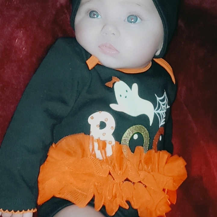 Rosie-maria joined the competition — help win amazing prizes! baby_toddler_clothing, black, doll, eye, headgear, mammal, neck, orange, organ, outerwear, pattern, plush, sleeve, stuffed_toy, t_shirt, textile, thigh, toy, vertebrate, white