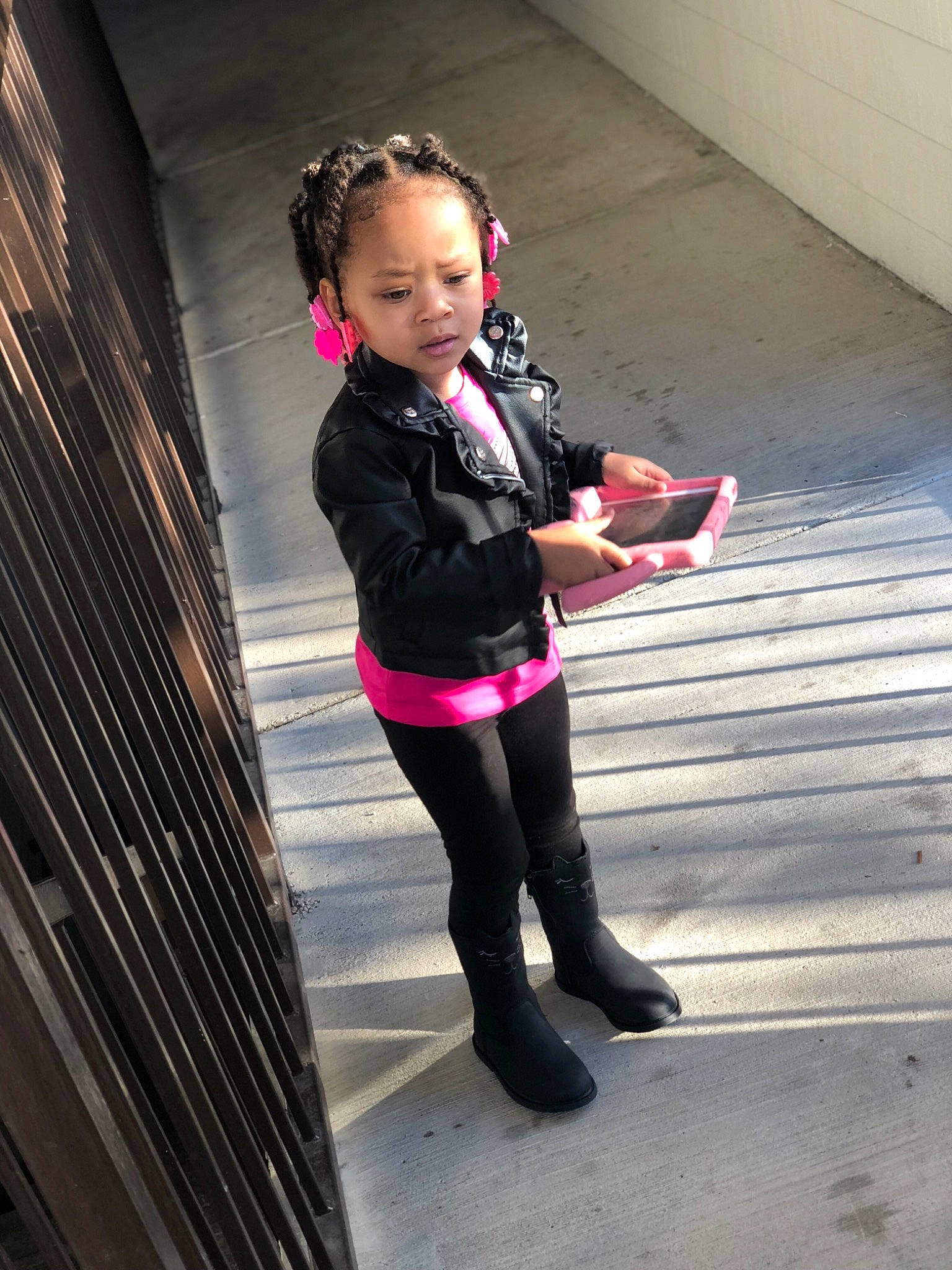 Ali is registered to the contest to win money with this photo: child, clothing, costume, day, fashion_accessory, footwear, fun, girl, jeans, leg, outerwear, person, pink, red, shoe, shoulder, smile, snapshot, standing, textile