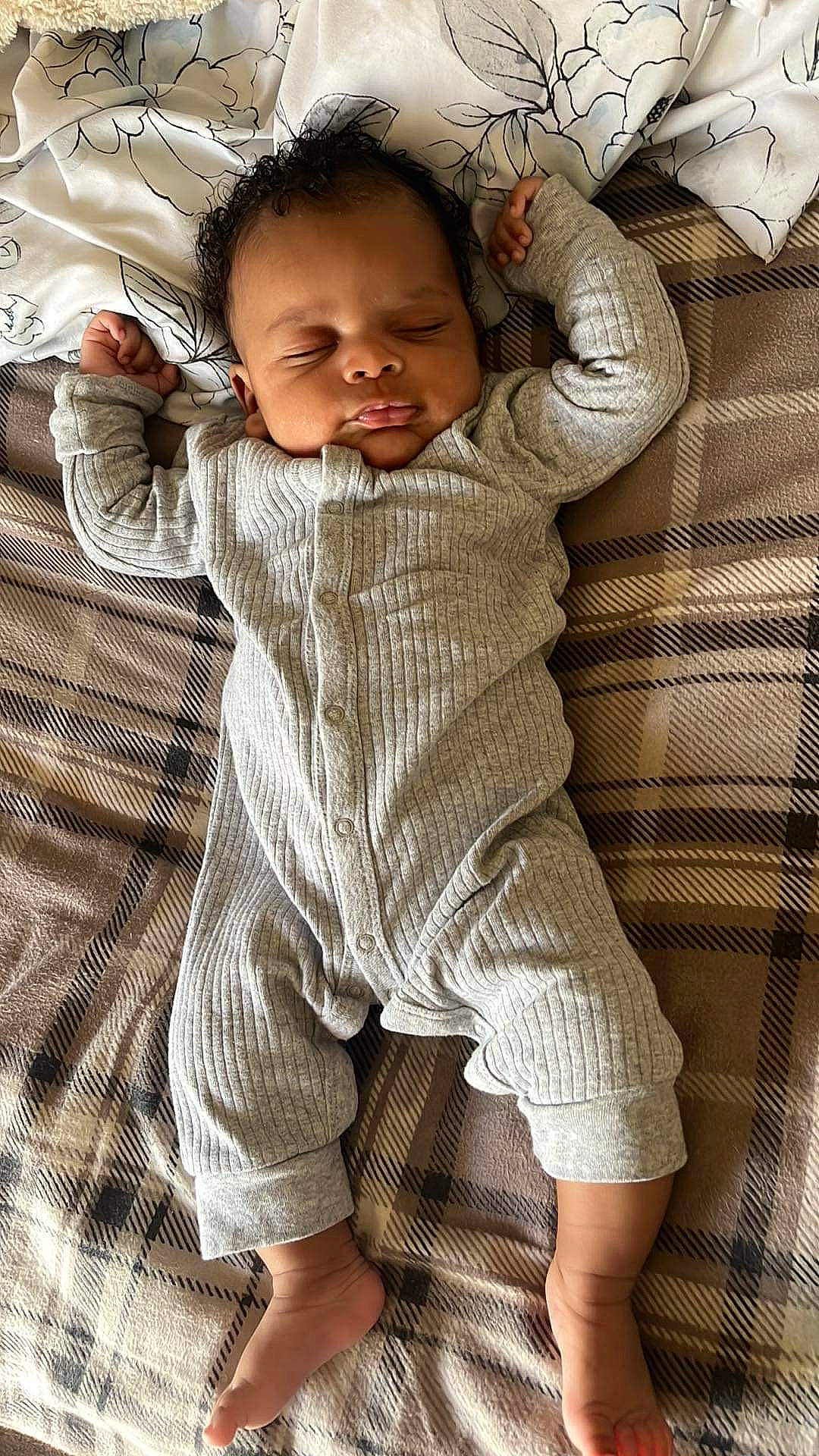 Jaiden is registered to the contest to win money with this photo: baby, baby_toddler_clothing, child, collar, comfort, dress_shirt, face, facial_expression, hand, happy, human_leg, linens, nose, pattern, person, skin, sleeve, smile, textile, thumb