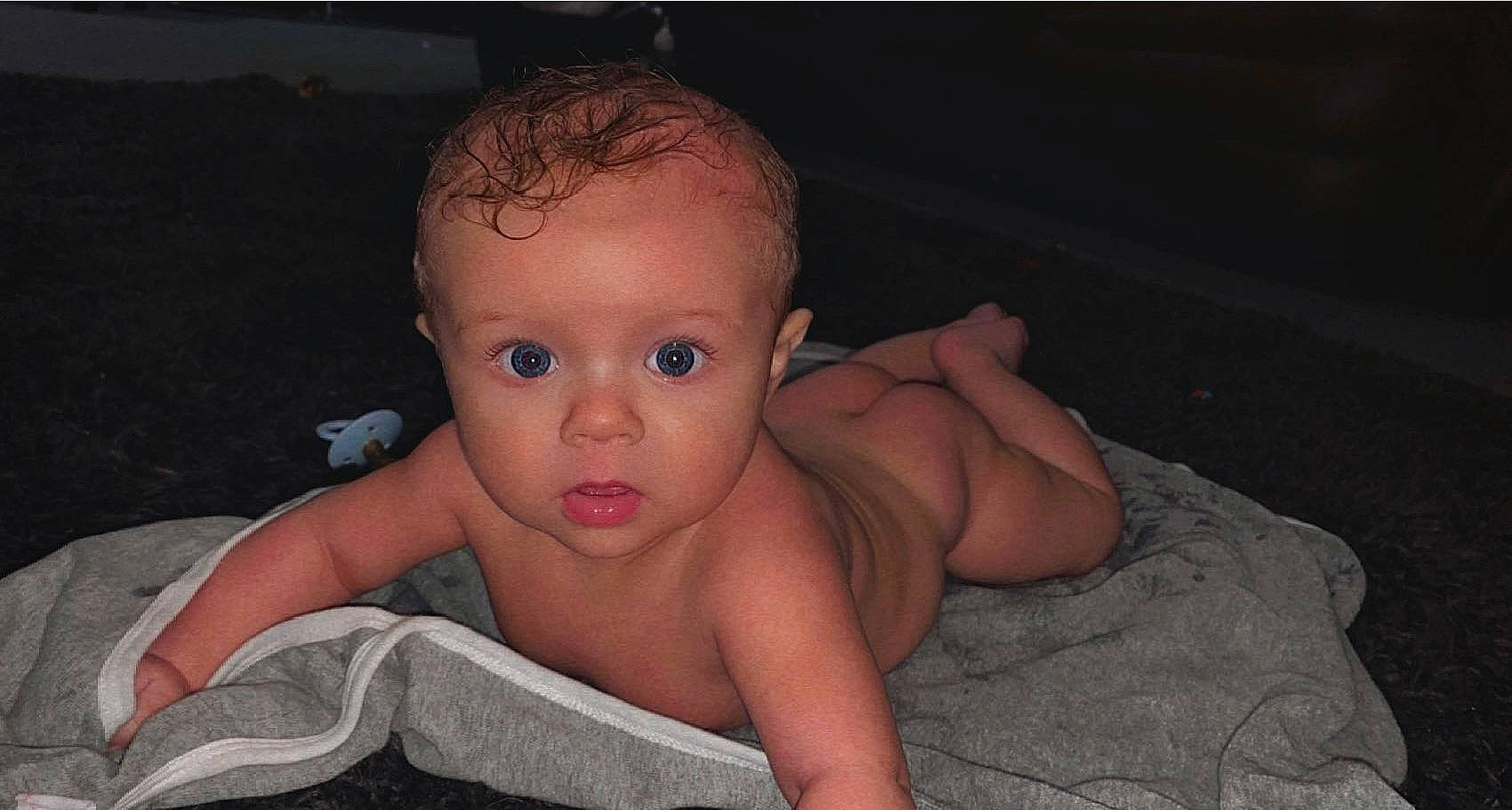 Hayden is registered to the contest to win money with this photo: arm, baby, cheek, chest, comfort, ear, eyelash, flash_photography, hand, head, human_body, iris, leg, lip, neck, nose, person, stomach, surprise, thumb