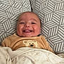 Islem a rejoint le concours — aidez-le/la à gagner de superbes lots ! baby, bear, blanket, child, clothing, cozy, cute, face, happy, indoors, infant, lying_down, pattern, person, pillow, portrait, smile, soft, tongue, warm