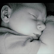Ashlynn Dann is registered to the contest to win money with this photo: baby, sleeping, face, close_up, black_and_white, infant, peaceful, soft_light, blanket, portrait, child, nose, ear, mouth, skin, quiet, rest, cozy, cuddle, calm