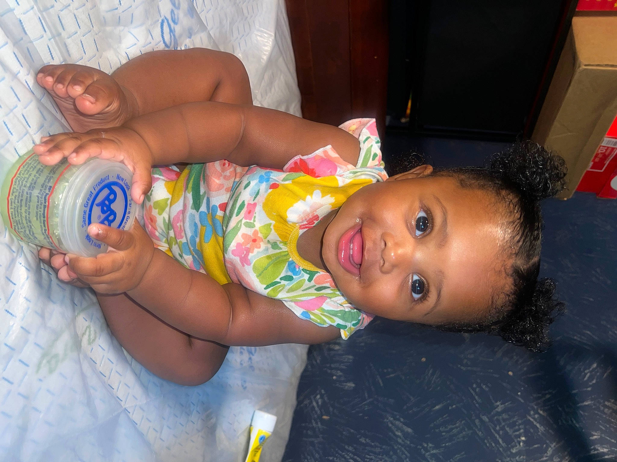 Jenesis is registered to the contest to win money with this photo: abdomen, aluminum_can, cheek, chest, child, finger, fun, happy, human_body, human_leg, mouth, nail, nose, person, plastic_bottle, skin, smile, thigh, tin_can, toddler