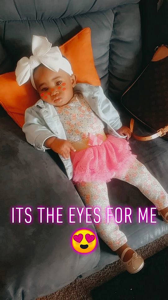 Karma joined the competition — help win amazing prizes! baby, baby_toddler_clothing, chair, child, comfort, event, face, facial_expression, finger, fun, happy, human_leg, knee, lap, leg, magenta, person, pink, shoe, thigh