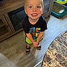 Legend joined the competition — help win amazing prizes! child, boy, smiling, blonde_hair, blue_eyes, tshirt, shorts, sandals, wood_floor, table, marble_table, baby_gear, indoor, happy, standing, looking_up, person, furniture, cabinet, home