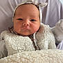 Mia participe au concours pour gagner de l'argent avec cette photo : baby, infant, headband, bow, blanket, fluffy, white, clothing, portrait, face, cute, child, cozy, soft, indoor, newborn, expression, person, warm, seated