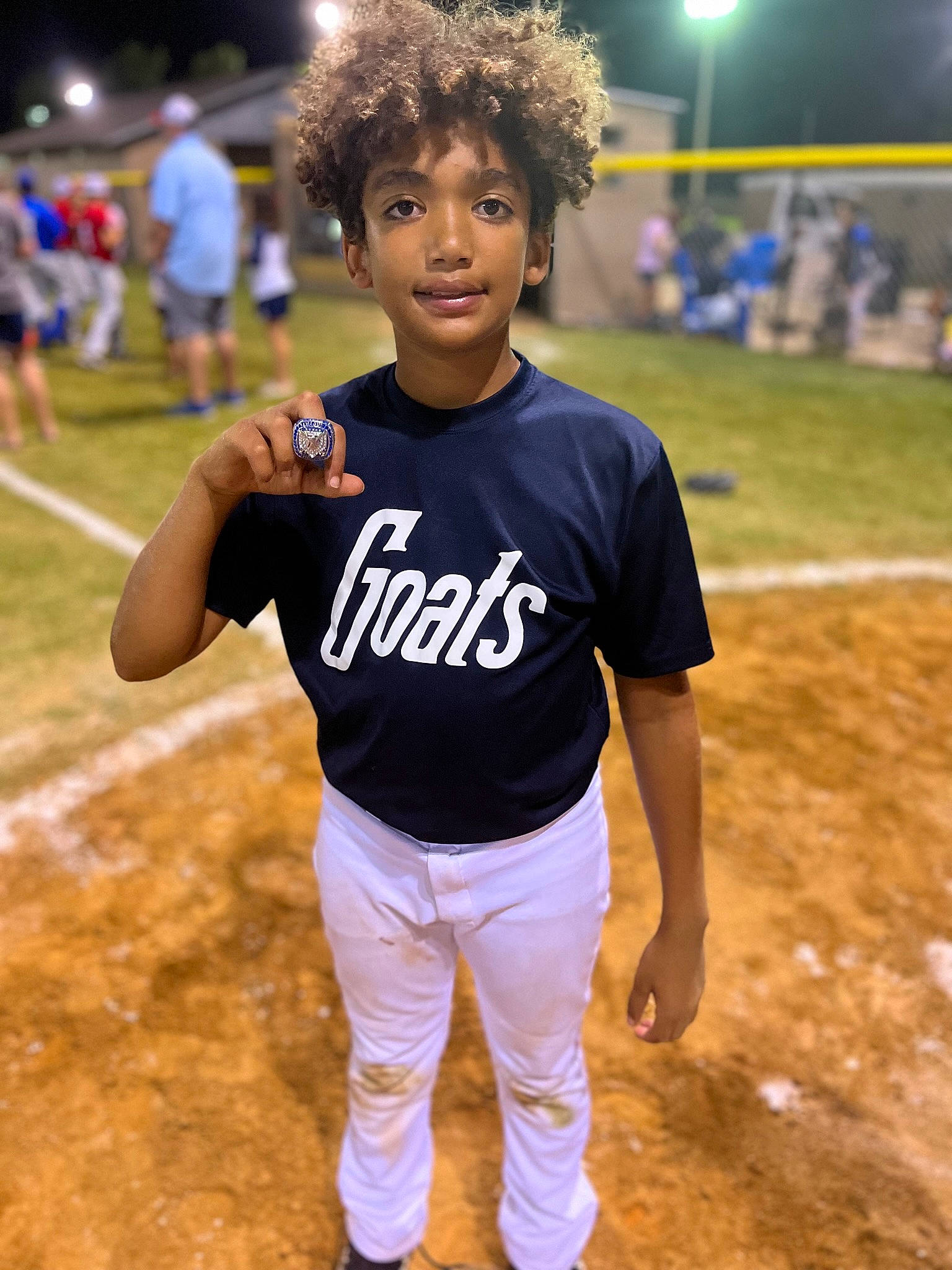 Antonio is registered to the contest to win money with this photo: ball_game, baseball, baseball_equipment, baseball_player, baseball_uniform, championship, college_baseball, competition_event, fun, grass, happy, jersey, person, player, smile, sports, sports_uniform, sportswear, t_shirt, team_sport