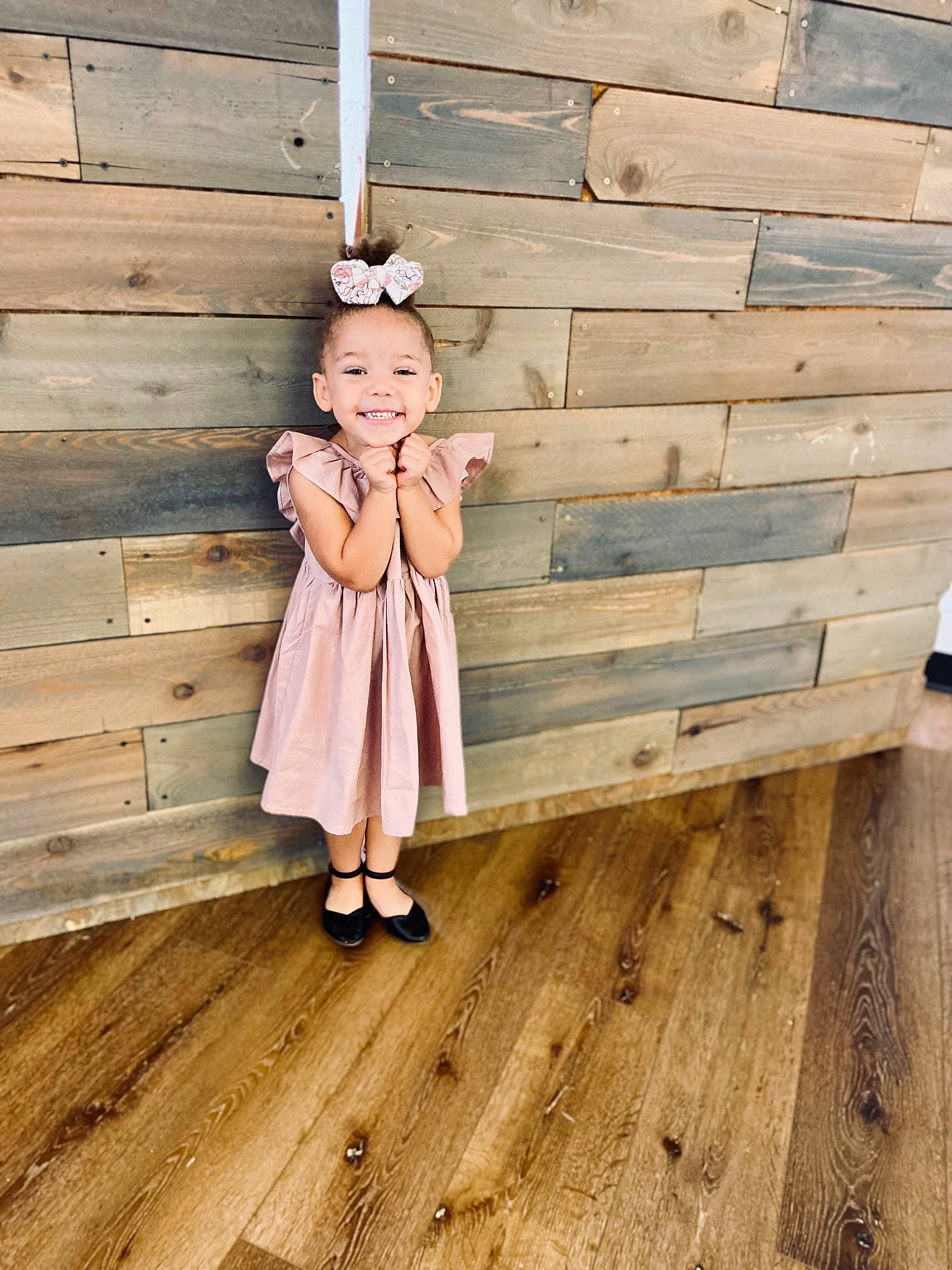 Emerson is registered to the contest to win money with this photo: baby_toddler_clothing, child, dress, flooring, happy, hardwood, house, joy, laminate_flooring, lumber, pattern, peach, person, plank, smile, stairs, toddler, varnish, wheel, wood
