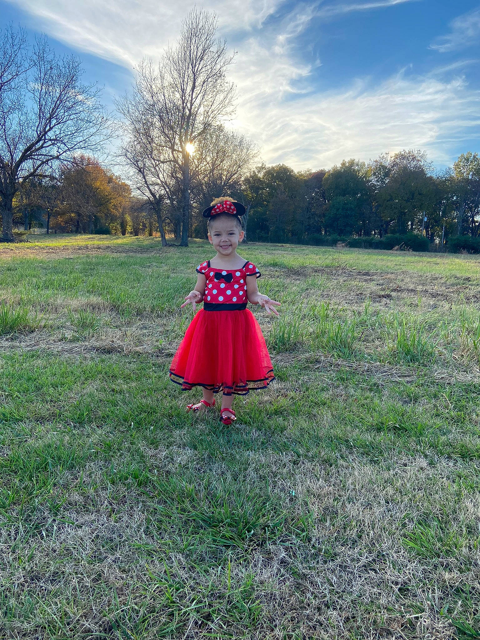 Emerson is registered to the contest to win money with this photo: baby_toddler_clothing, cloud, dress, grass, grass_family, grassland, happy, joy, landscape, leisure, meadow, natural_landscape, people_in_nature, person, plain, plant, prairie, recreation, sky, summer