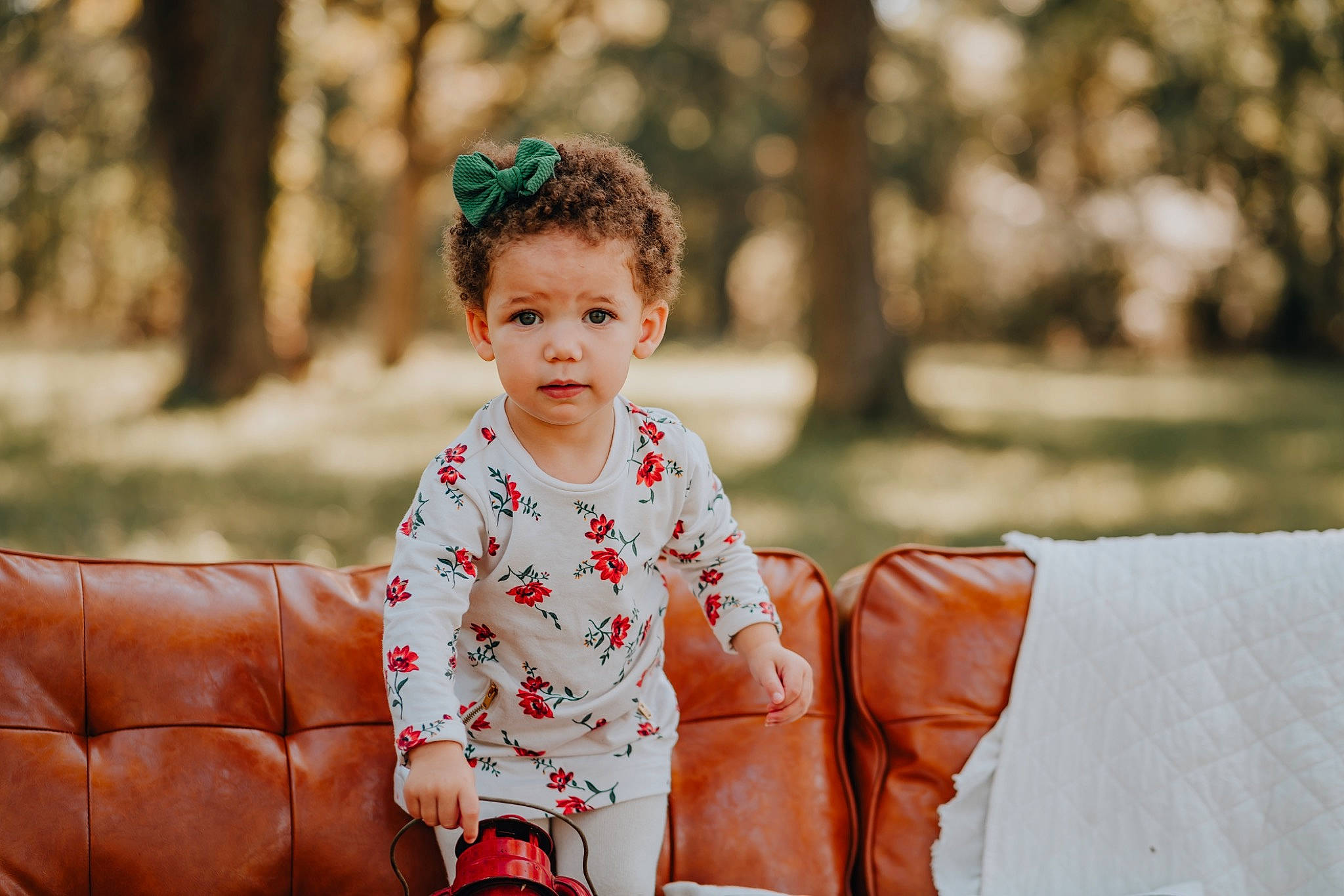 Emerson is registered to the contest to win money with this photo: baby_toddler_clothing, child, flash_photography, fun, grass, happy, laugh, leisure, people_in_nature, person, play, playing_with_kids, portrait, portrait_photography, recreation, sitting, sleeve, smile, toddler, tree