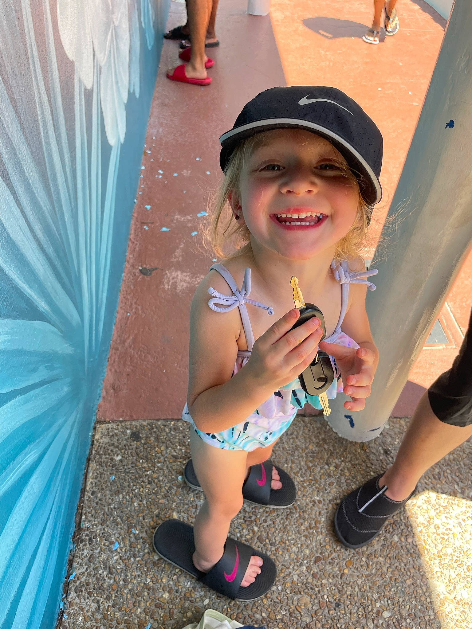 Jaylynn is registered to the contest to win money with this photo: azure, baseball_cap, cap, cool, facial_expression, fashion, finger, fun, happy, hat, headgear, headwear, joy, knee, leg, leisure, person, pink, public_space, shoe