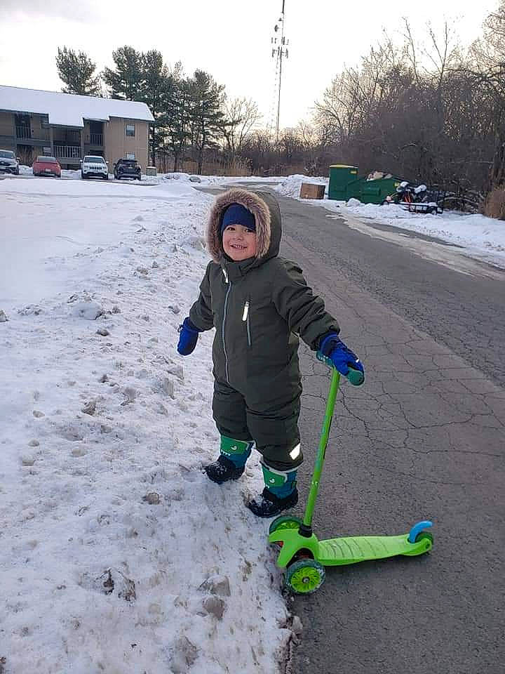 Anthony joined the competition — help win amazing prizes! asphalt, automotive_tire, car, freezing, fun, geological_phenomenon, grass, headwear, jacket, joy, outerwear, person, recreation, sky, slope, sneakers, snow, sports_equipment, tire, toddler