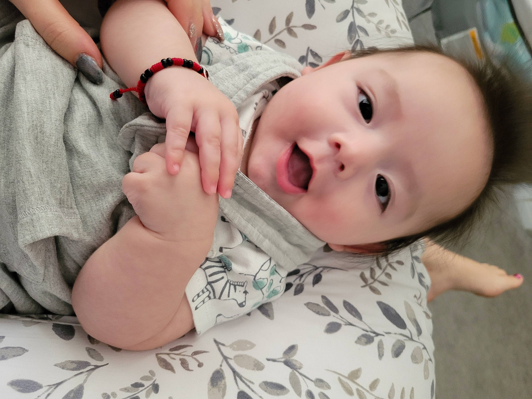 Louie is registered to the contest to win money with this photo: baby, baby_toddler_clothing, cheek, comfort, eye, eyebrow, eyelash, finger, gesture, hand, happy, iris, lip, mouth, nail, nose, person, skin, sleeve, smile