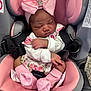 Neriah is registered to the contest to win money with this photo: baby, newborn, infant, sleeping, car_seat, pink, bow, headband, socks, floral, clothing, child, cute, adorable, peaceful, resting, indoor, person, seatbelt, toddler