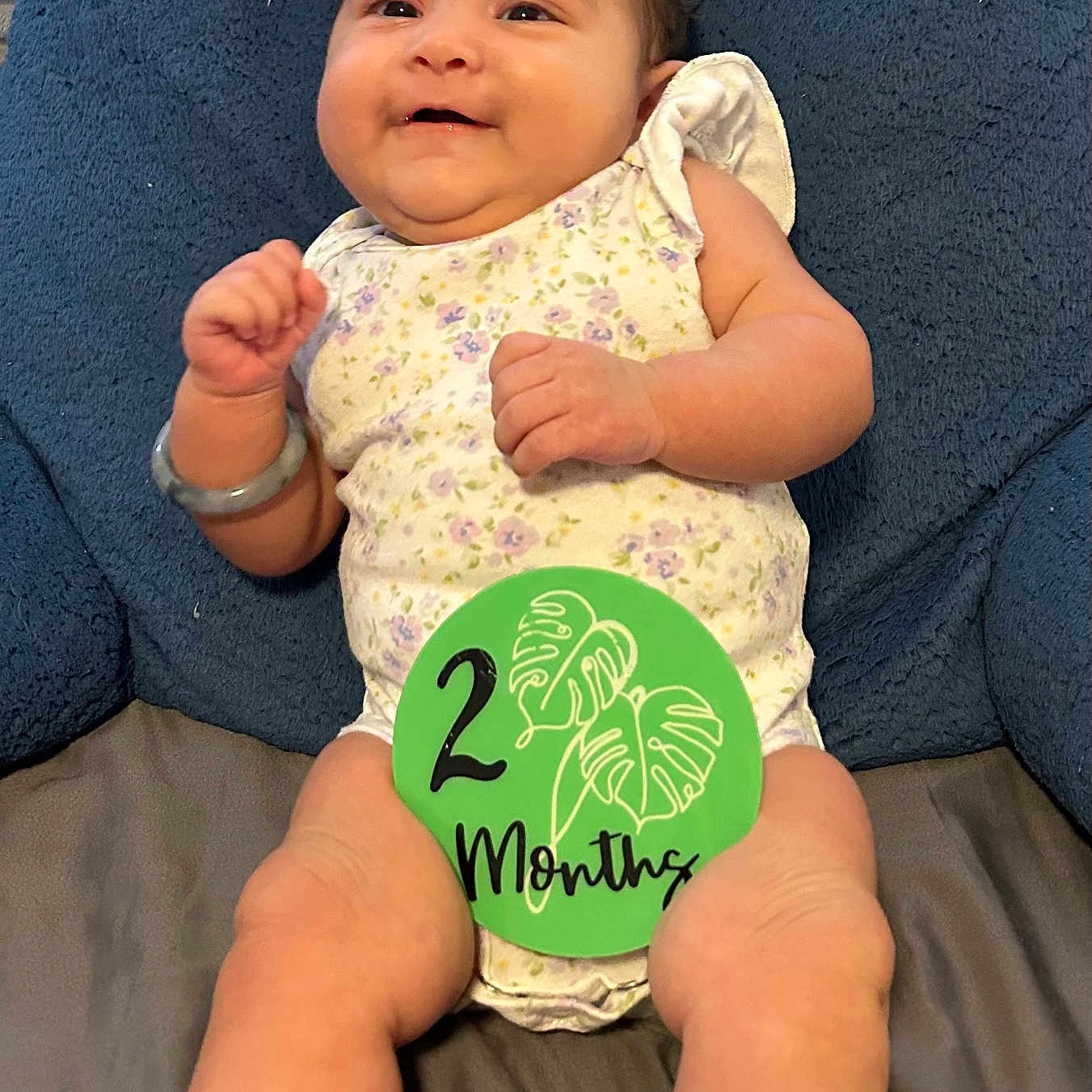 Mira joined the competition — help win amazing prizes! americanfootball, americanfootballball, baby, ball, clothing, couch, cushion, face, football, furniture, happy, head, homedecor, newborn, person, photography, portrait, sitting, sport, t_shirt