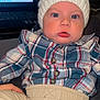 Emyr Gael is registered to the contest to win money with this photo: baby, child, infant, hat, knit_hat, plaid_shirt, blue_eyes, pants, beige_pants, indoor, technology, laptop, face, person, seated, cute, warm_clothing, portrait, curious, cozy