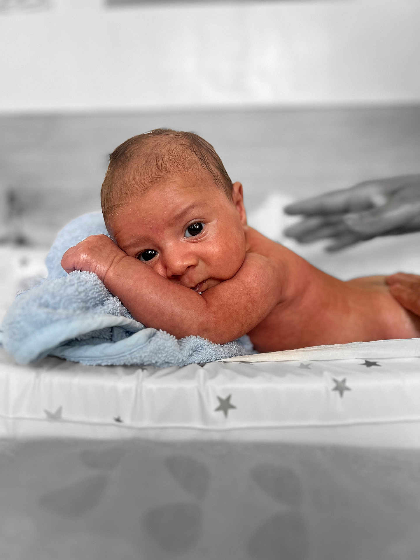 Devon joined the competition — help win amazing prizes! baby, infant, towel, skin, face, eyes, hand, bed, blanket, resting, newborn, cute, lying_down, soft_texture, closeup, portrait, expression, human, curious, indoors