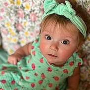 Halle joined the competition — help win amazing prizes! baby, child, headband, dress, ladybug_pattern, floral_background, portrait, cute, infant, looking_up, pink, yellow, green, patterned_clothing, closeup, young_child, indoors, soft_light, adorable, person