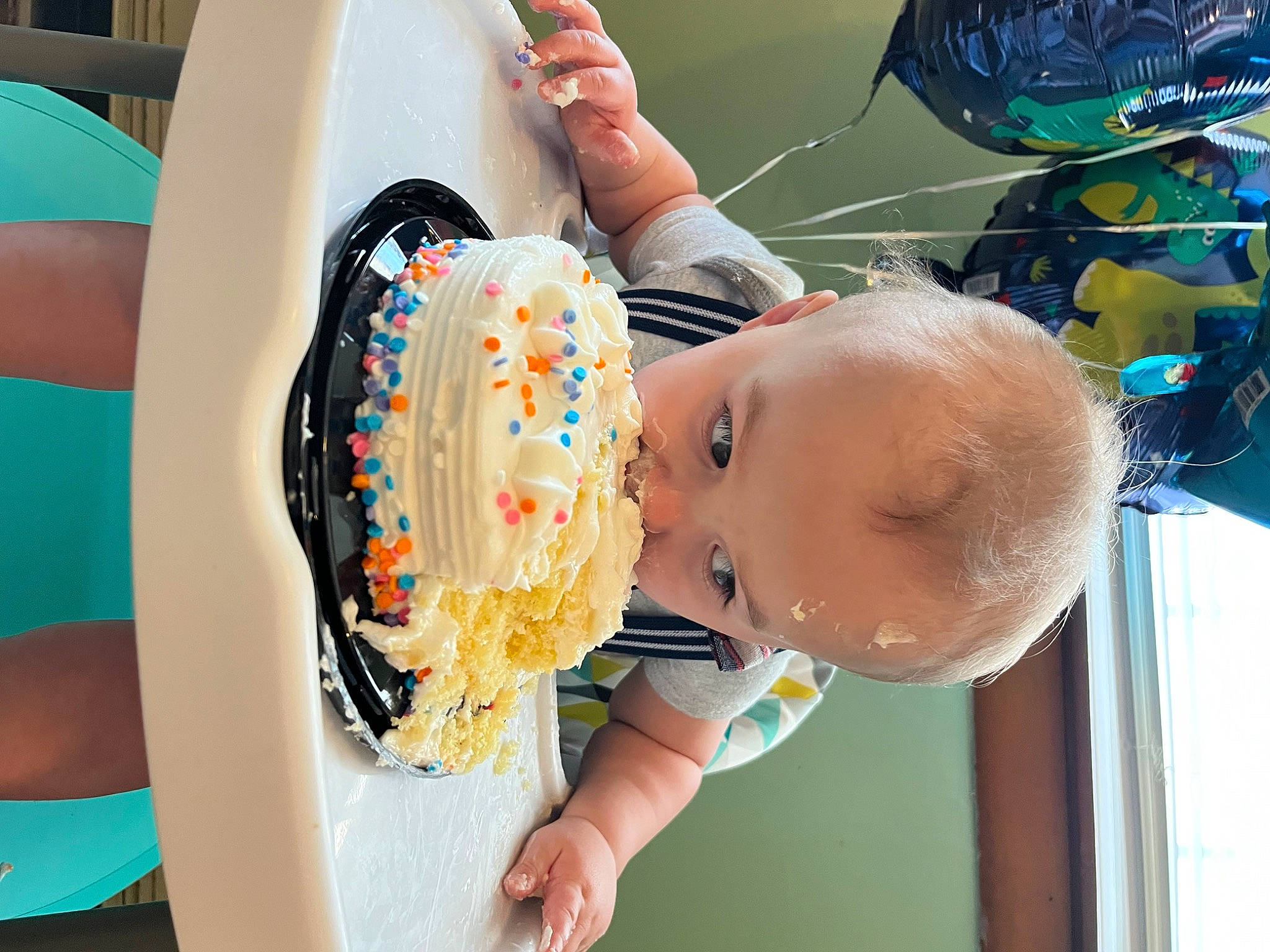 Jeffery is registered to the contest to win money with this photo: baby, baking, birthday_cake, blue, buttercream, cake, chair, child, dairy, dessert, fast_food, food, fun, happy, leisure, party_supply, pastry, person, room, sweetness