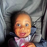 Aaron participe au concours pour gagner de l'argent avec cette photo : child, toddler, smiling, car_seat, happy, face, close_up, dimples, clothing, seatbelt, infant, portrait, baby, young_child, cute, person, expression, indoors, joyful, bright_eyes