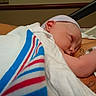 Colton is registered to the contest to win money with this photo: adult, baby, blanket, cap, child, closeup, comfort, cute, hospital, hospital_bed, infant, medical, newborn, resting, skin, sleeping, swaddled, tattoo, tender_moment, wristband