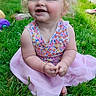 Laikyn is registered to the contest to win money with this photo: barefoot, child, colorful_clothing, curly_hair, cute, daytime, dress, grass, happy, nature, outdoor, person, playful, portrait, sitting, smiling, summer, sunlight, toddler, young_child