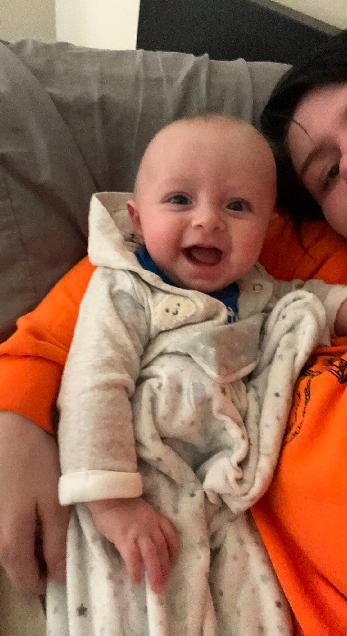 Ares is registered to the contest to win money with this photo: baby, baby_toddler_clothing, cheek, child, comfort, eye, face, finger, happy, head, linens, lip, mouth, nose, person, sitting, skin, sleeve, smile, textile