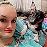 woman, dog, selfie, portrait, indoor, bedroom, bed, cuddling, pet, black_and_white_dog, pointy_ears, short_hair, face, smiling, casual_clothing, turquoise_shirt, text_overlay, heart, cozy, photography
