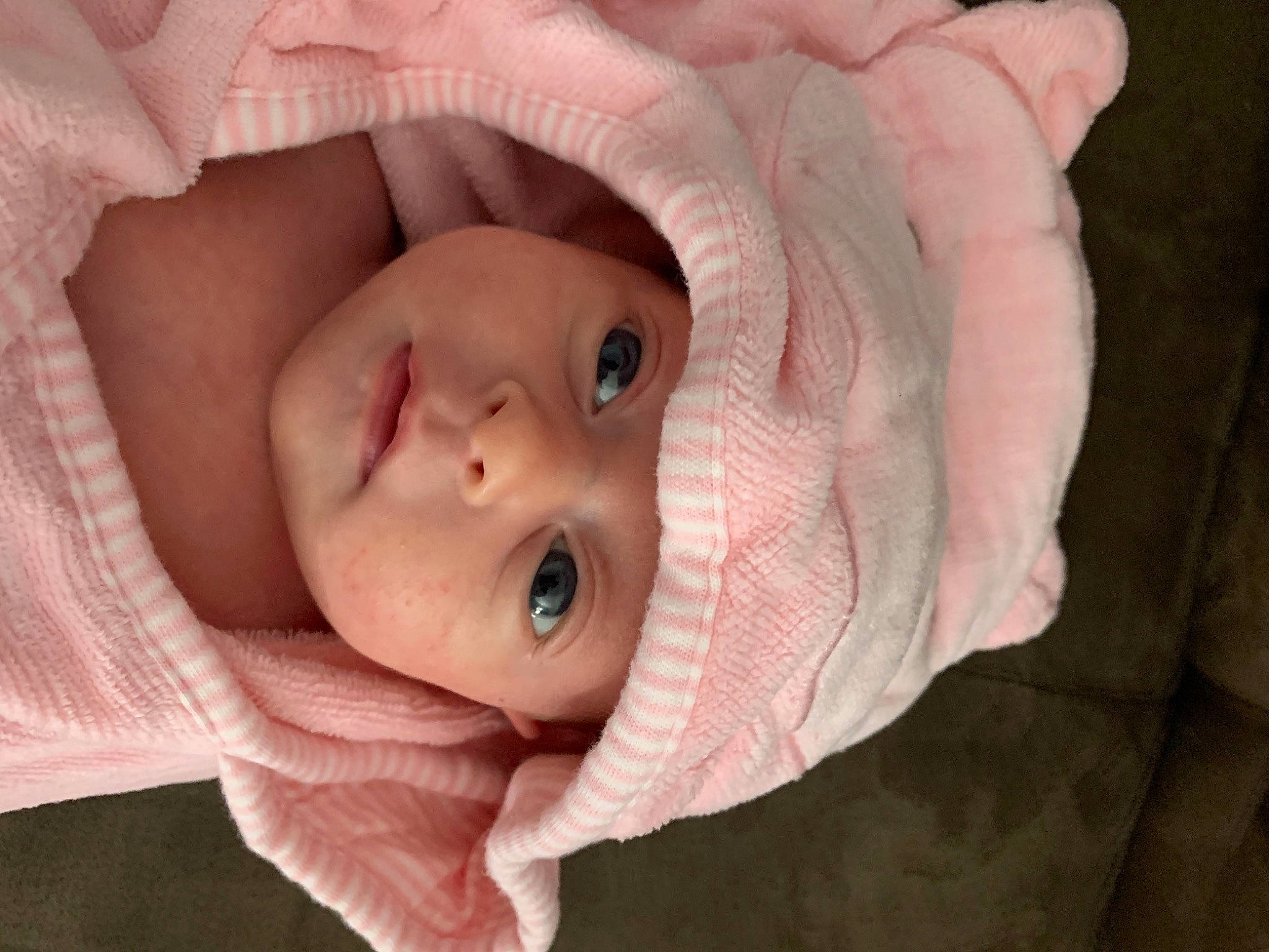 Ariel is registered to the contest to win money with this photo: baby, baby_products, cheek, child, chin, close_up, eye, face, head, headwear, lip, mouth, nose, person, photograph, photography, pink, portrait_photography, product, skin