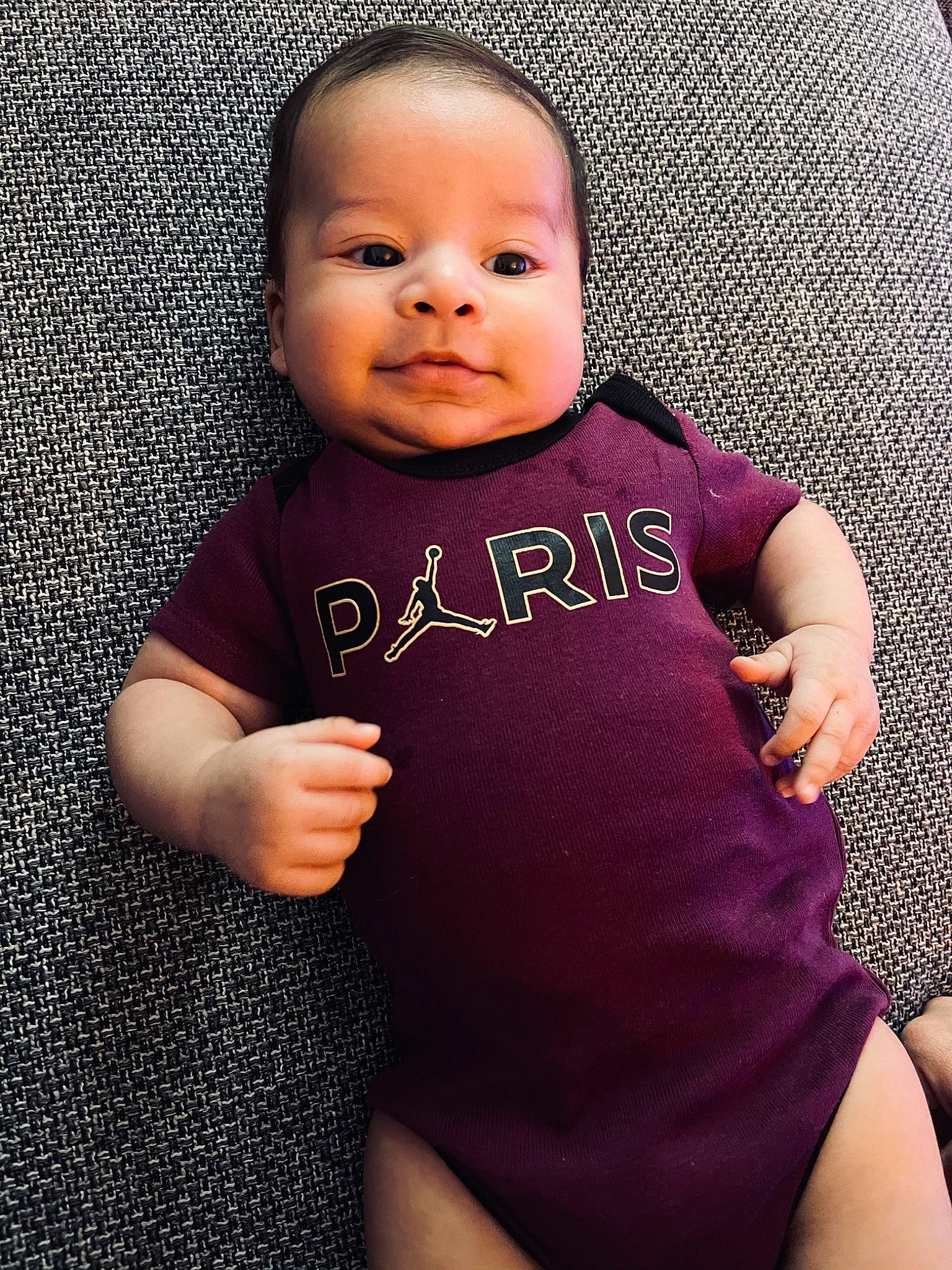 Layvin participe au concours pour gagner de l'argent avec cette photo : arm, baby_toddler_clothing, cheek, chin, clothing, eye, eyebrow, face, hand, head, human_body, joint, leg, lip, neck, nose, person, purple, shoulder, skin