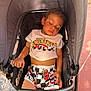 black, casual, child, clothing, curly_hair, eyelashes, face, graco, hand, outdoor, pink_skin, racecar, resting, shorts, sleeping, stroller, sunlight, toddler, tshirt, water_bottle