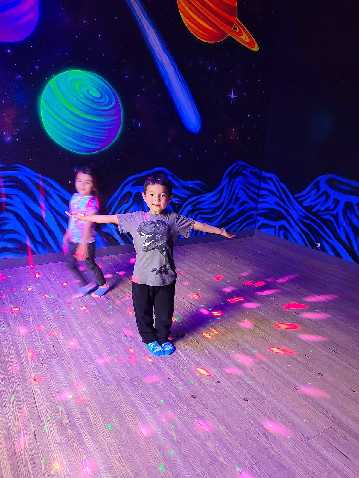 Abel is registered to the contest to win money with this photo: art, artist, astronomical_object, electric_blue, entertainment, event, fun, leisure, magenta, neon, performance_art, performing_arts, person, public_event, purple, science, space, tree, violet, visual_effect_lighting