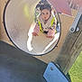Azra joined the competition — help win amazing prizes! child, curious, cute, daytime, fun, grass, handrail, jacket, leopard_print, outdoor, play, playground, slide, sunlight, toddler, tunnel, vest, winter_clothing, wood, young_child