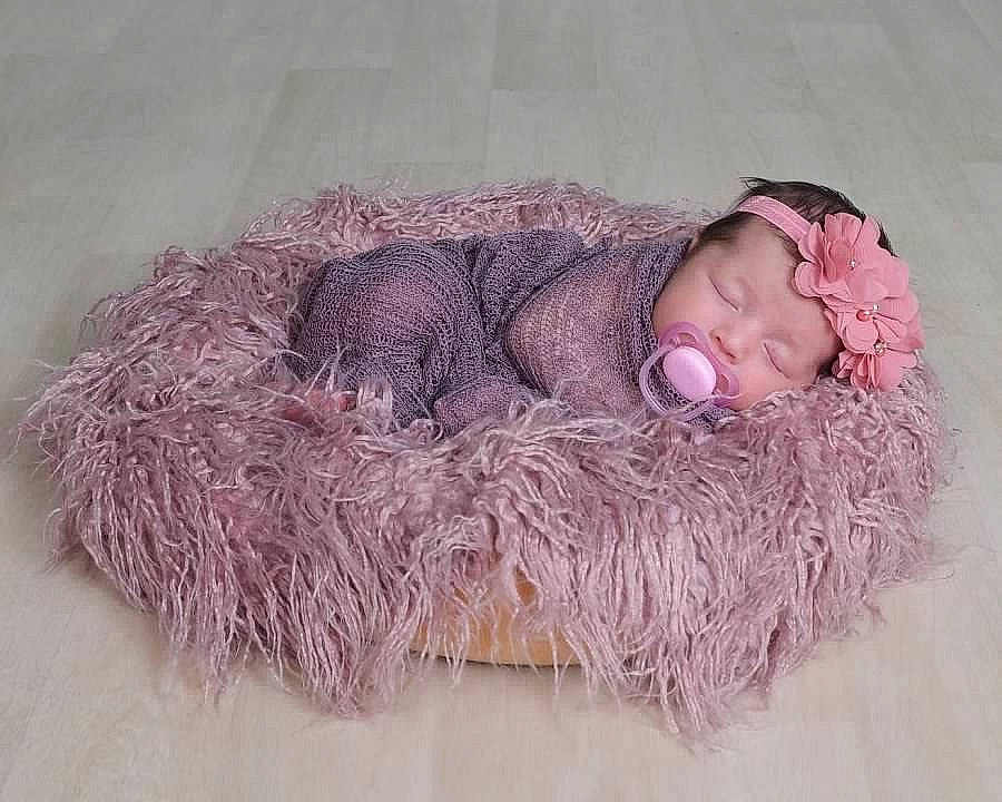 Eliyana joined the competition — help win amazing prizes! baby, baby_toddler_clothing, beanie, bonnet, cap, child, comfort, face, fashion_accessory, fur, knit_cap, linens, magenta, natural_material, pattern, person, portrait_photography, sleeve, toddler, wool